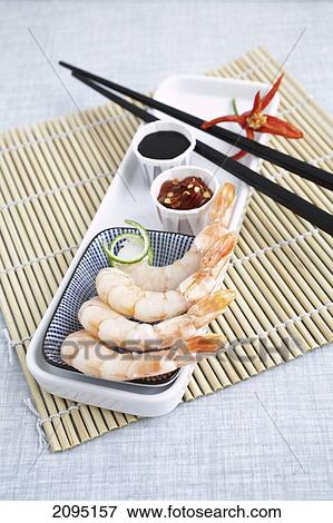 Raw shrimps with chopsticks and sauce on tray View Large Photo Image Stock Photo - Raw shrimps with chopsticks and sauce on tray . Fotosearch