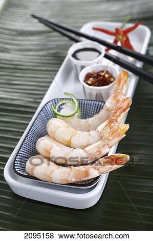 Raw shrimps with chopsticks and sauce on tray View Large Photo Image Stock Photo - Raw shrimps with chopsticks and sauce on tray . Fotosearch