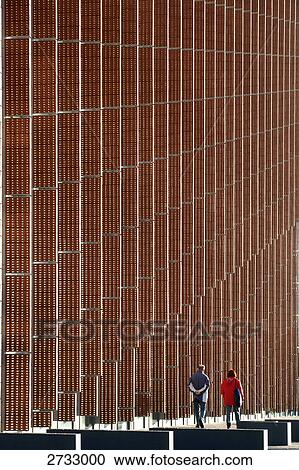 Rear view of couple walking at roadside View Large Photo Image Stock Image - Rear view of couple walking at roadside . Fotosearch