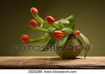 Stock Photo - Red tulips in flower vase . Fotosearch