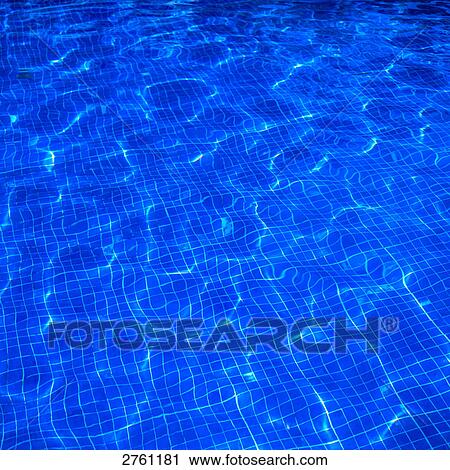 Stock Image - Reflections on water surface of swimming pool . Fotosearch