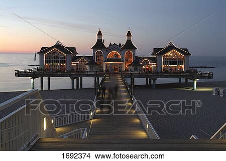 Resort lit up on beach at dusk View Large Photo Image Picture - Resort lit up on beach at dusk . Fotosearch