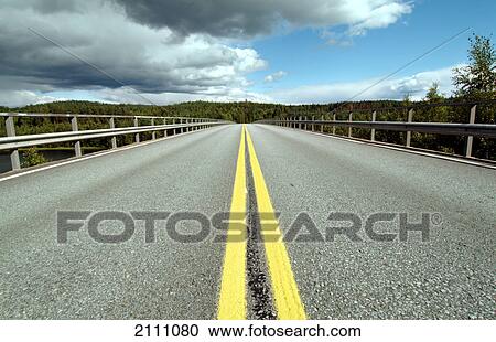 Road running through landscape View Large Photo Image Stock Image - Road running through landscape . Fotosearch