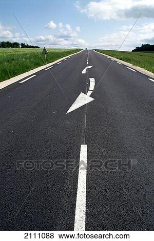 Stock Photo - Road running through landscape . Fotosearch