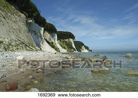 Rocks in shallow water View Large Photo Image Stock Photo - Rocks in shallow water . Fotosearch