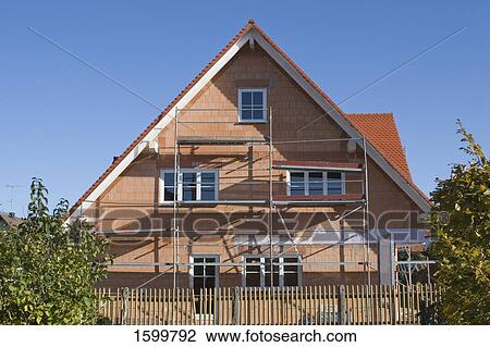 Scaffoldings on under construction house View Large Photo Image Stock Image - Scaffoldings on under construction house . Fotosearch