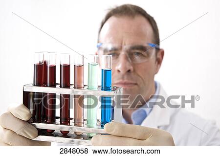 Scientist holding test tube rack View Large Photo Image Stock Photo - Scientist holding test tube rack . Fotosearch