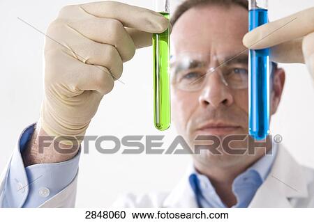 Scientist holding test tubes View Large Photo Image Stock Image - Scientist holding test tubes . Fotosearch