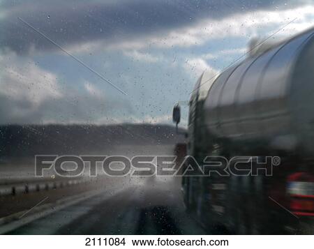 Semi truck of wet road View Large Photo Image Picture - Semi truck of wet road . Fotosearch