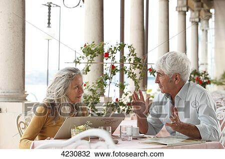Senior couple in a restaurant, Italy, Gardone Riviera View Large Photo Image Stock Image - Senior couple in a restaurant, Italy, Gardone Riviera . Fotosearch