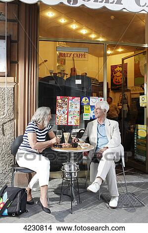 Senior couple in a sidewalk cafe, Italy, Rapallo View Large Photo Image Picture - Senior couple in a sidewalk cafe, Italy, Rapallo . Fotosearch