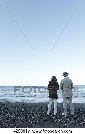Senior couple on beach, Italy, Sori View Large Photo Image Stock Photo - Senior couple on beach, Italy, Sori . Fotosearch