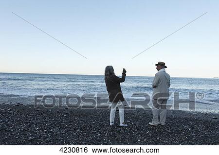 Senior couple on beach, Italy, Sori View Large Photo Image Stock Photograph - Senior couple on beach, Italy, Sori . Fotosearch
