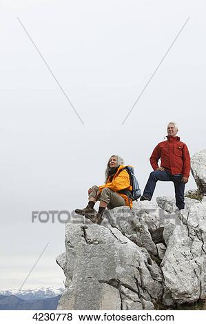 Senior couple on mountain peak, Italy, Monte Baldo View Large Photo Image Stock Photo - Senior couple on mountain peak, Italy, Monte Baldo . Fotosearch