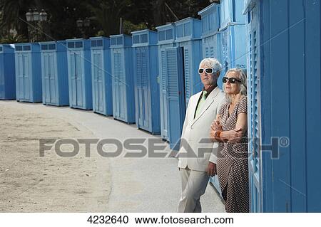 Senior couple standing at changing cubicle outdoors, Italy, Rapallo View Large Photo Image Stock Image - Senior couple standing at changing cubicle outdoors, Italy, Rapallo . Fotosearch
