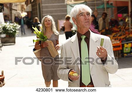 Senior couple strolling through town, Italy, Rapallo View Large Photo Image Stock Image - Senior couple strolling through town, Italy, Rapallo . Fotosearch