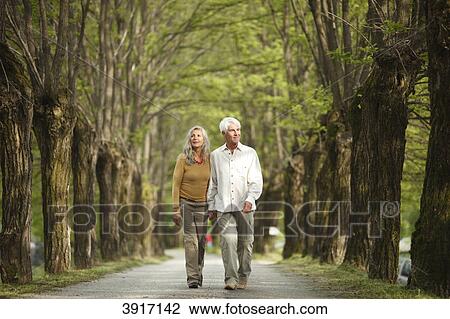 Senior couple walking, North Italy, Europe, Telve, Dolomites View Large Photo Image Stock Image - Senior couple walking, North Italy, Europe, Telve, Dolomites . Fotosearch