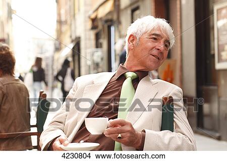 Senior man at a sidewalk cafe, Italy, Rapallo View Large Photo Image Picture - Senior man at a sidewalk cafe, Italy, Rapallo . Fotosearch