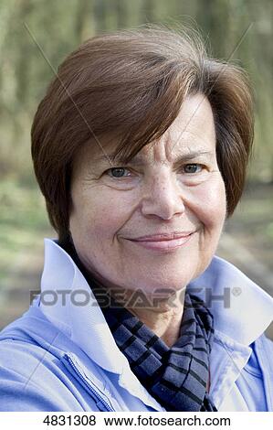 Senior woman smiling at camera View Large Photo Image Stock Photo - Senior woman smiling at camera . Fotosearch