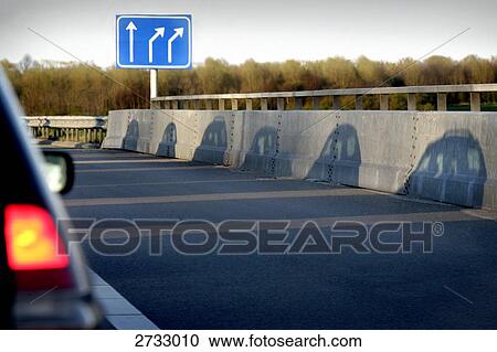 Stock Image - Shadow of cars on road . Fotosearch