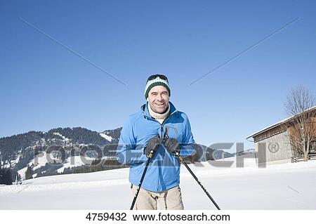 Smiling man in winter landscape, Tannheimer Tal, Tyrol, Austria View Large Photo Image Stock Image - Smiling man in winter landscape, Tannheimer Tal, Tyrol, Austria . Fotosearch