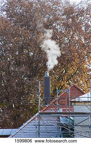 Smoke emitting from chimney View Large Photo Image Stock Photograph - Smoke emitting from chimney . Fotosearch