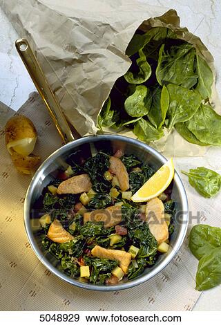 Stock Photo - spinach with pieces of salmon . Fotosearch