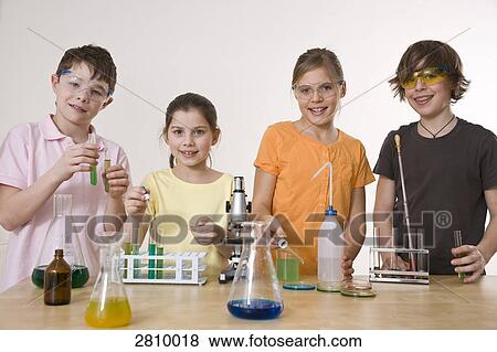 Students doing experiment in chemistry laboratory View Large Photo Image Stock Photo - Students doing experiment in chemistry laboratory . Fotosearch