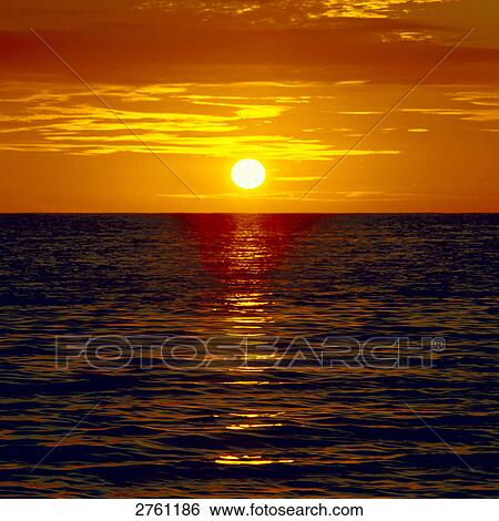 Stock Photograph - Sunset over sea . Fotosearch