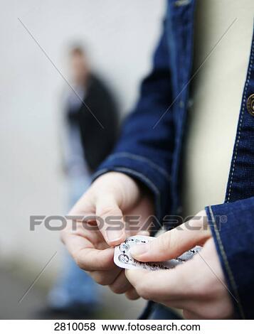 Teenage girl unpacking birth control pill View Large Photo Image Stock Photo - Teenage girl unpacking birth control pill . Fotosearch