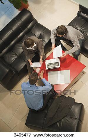 Three business people in a meeting View Large Photo Image Stock Photo - Three business people in a meeting . Fotosearch