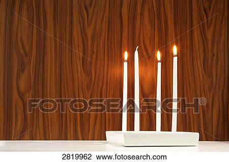 Three candles burning out of four View Large Photo Image Stock Image - Three candles burning out of four . Fotosearch