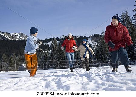 Tourists enjoying in snow covering landscape View Large Photo Image Picture - Tourists enjoying in snow covering landscape . Fotosearch