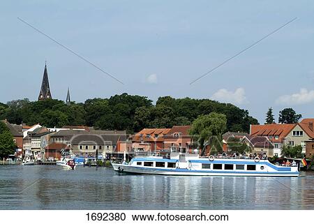 Tourists on boat at harbor View Large Photo Image Stock Image - Tourists on boat at harbor . Fotosearch