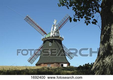 Traditional windmill in field View Large Photo Image Stock Image - Traditional windmill in field . Fotosearch