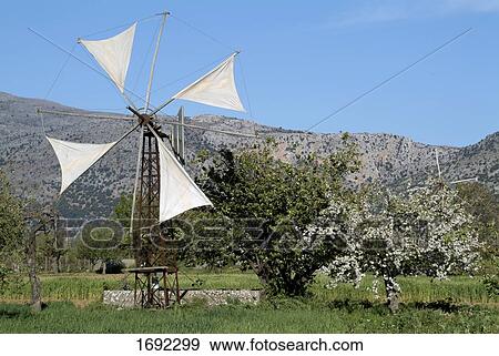 Stock Photo - Traditional windmill in field . Fotosearch