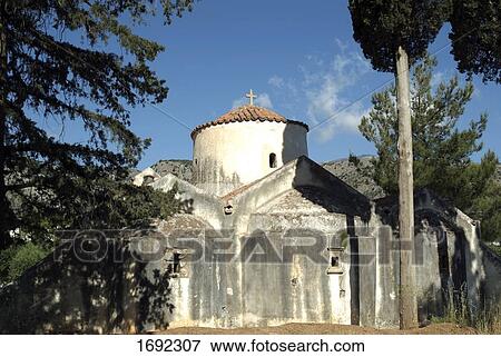 Stock Photo - Trees in front of church . Fotosearch