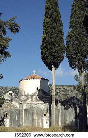 Trees in front of church View Large Photo Image Stock Photograph - Trees in front of church . Fotosearch