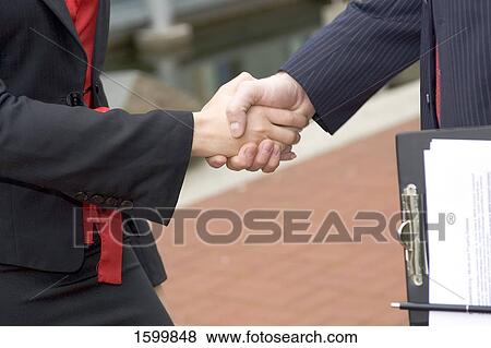 Two businesspeople shaking hands View Large Photo Image Stock Photo - Two businesspeople shaking hands . Fotosearch