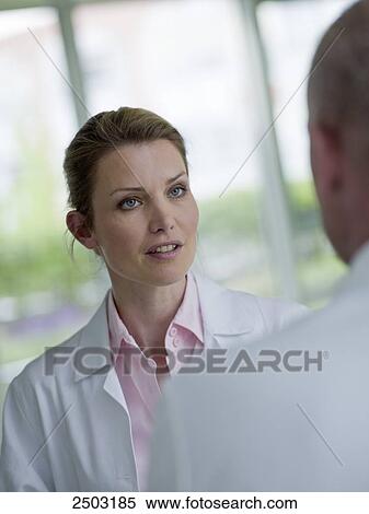 Stock Photography - Two doctors discussing . Fotosearch