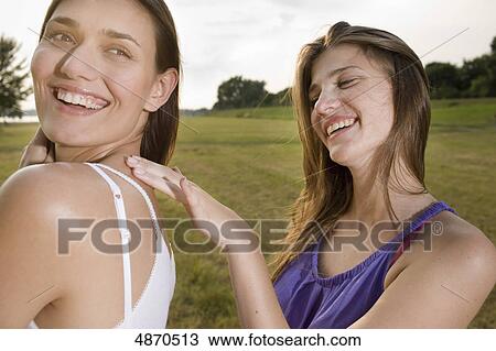 Two happy young women outdoors View Large Photo Image Stock Image - Two happy young women outdoors . Fotosearch