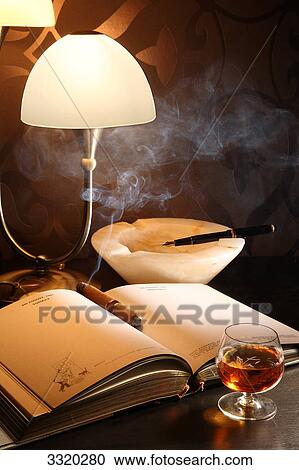 Unlit cigar on a personal organizer View Large Photo Image Stock Image - Unlit cigar on a personal organizer . Fotosearch