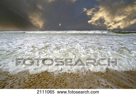 Stock Photography - Waves on beach . Fotosearch