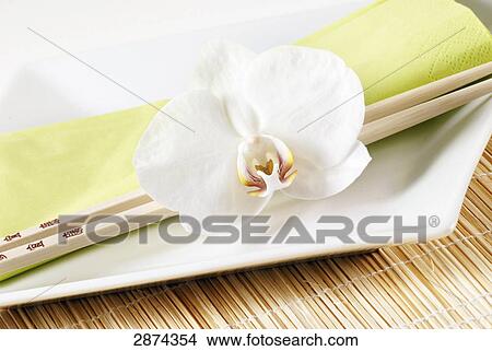 White flowers with chopsticks and napkin on plate View Large Photo Image Picture - White flowers with chopsticks and napkin on plate . Fotosearch