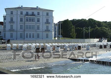 Stock Image - Wicker beach chairs on beach . Fotosearch
