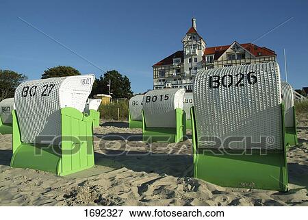 Stock Photo - Wicker beach chairs on beach . Fotosearch