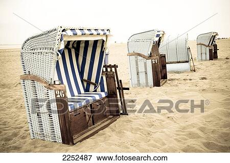Stock Photo - Wicker beach chairs on beach . Fotosearch