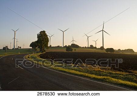 Stock Image - Wind turbines in field . Fotosearch