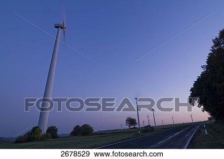 Stock Photo - Wind turbines in field . Fotosearch
