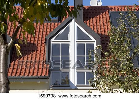 Stock Photo - Window on roof of house . Fotosearch